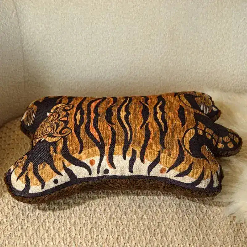 Decorative throw pillow featuring a tiger stripe design, perfect for adding a wild touch to any room.