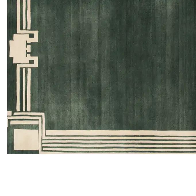 Top view of the Labyrinth Ascent Hand Tufted Wool Rug, featuring a contemporary design with a deep green base and intricate cream geometric patterns. This luxurious area rug is perfect for adding elegance to living room spaces, making it a standout contemporary wool rug choice.