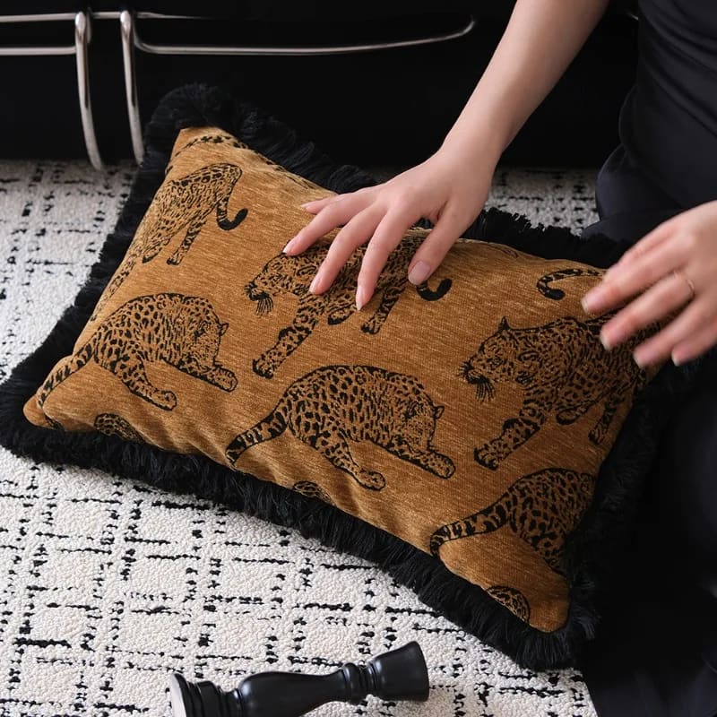 Lavish leopard lounge throw pillow cover featuring a stylish design with leopard patterns and fringe detailing, perfect for adding a touch of elegance to any living space.
