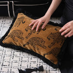 Lavish leopard lounge throw pillow cover featuring a stylish design with leopard patterns and fringe detailing, perfect for adding a touch of elegance to any living space.