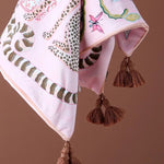 Lavish Twin Leopard Oasis Throw Pillow Cover featuring a vibrant pink background with leopard print and decorative tassels, perfect for adding a touch of elegance to your home decor.