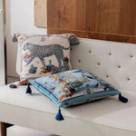 Lavish throw pillows featuring twin leopard designs with decorative tassels, perfect for adding a touch of elegance to any space.