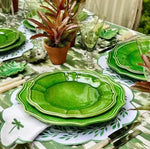 leafy lace placemats in white linen with green leaf dragonfly embroidery under bright green ceramic plates on striped cloth
