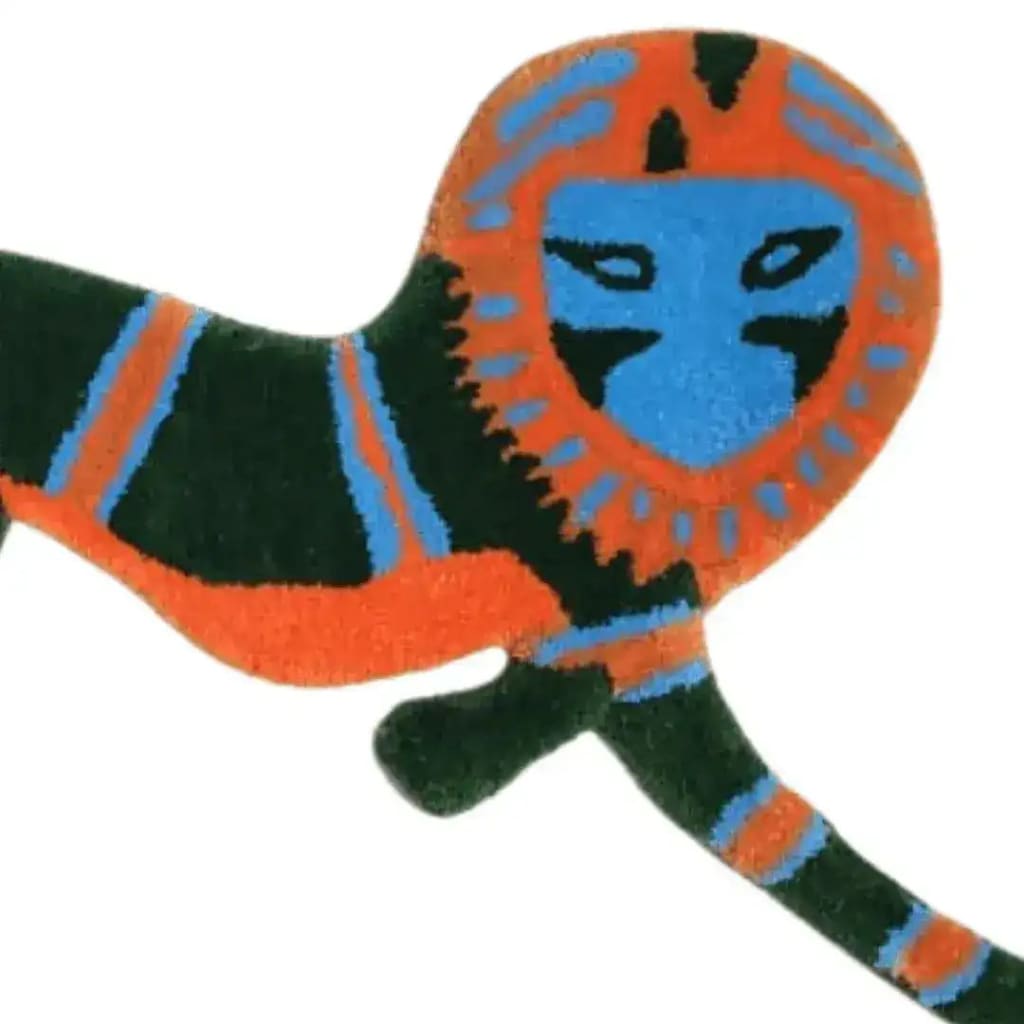 Vibrant Leaping Monkey Hanuman Accent Wool Rug showcasing a colorful abstract design, perfect for adding a touch of whimsy to any dining room or bedroom. This vintage-style area rug offers a unique blend of orange, blue, and green tones, making it an ideal choice for both formal dining room rugs and rugs for bedroom spaces.