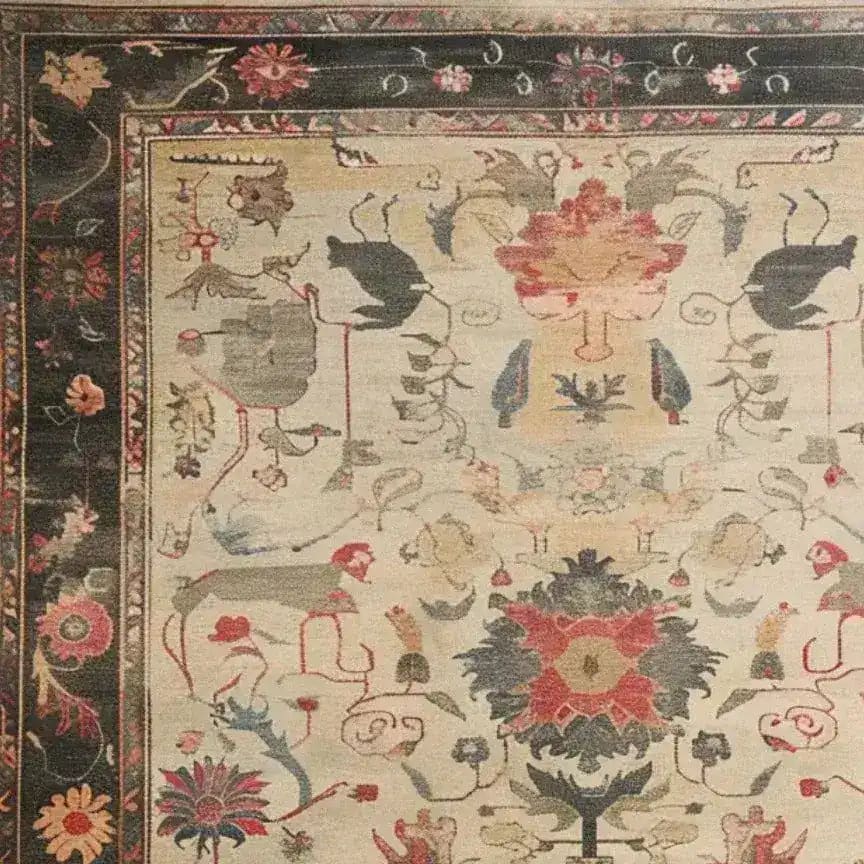 Top view of the Legacy of Petals Hand Knotted Area Rug showcasing a vintage floral design with intricate patterns reminiscent of Persian rugs. This beautiful living room area rug features a rich tapestry of colors and traditional motifs.