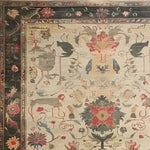 Top view of the Legacy of Petals Hand Knotted Area Rug showcasing a vintage floral design with intricate patterns reminiscent of Persian rugs. This beautiful living room area rug features a rich tapestry of colors and traditional motifs.