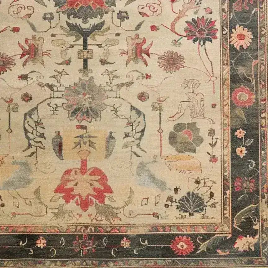 A beautifully detailed Legacy of Petals Hand Knotted Area Rug, showcasing intricate floral patterns reminiscent of vintage Persian rugs. The rug features a rich array of colors with a traditional design, perfect for adding elegance to any living room.