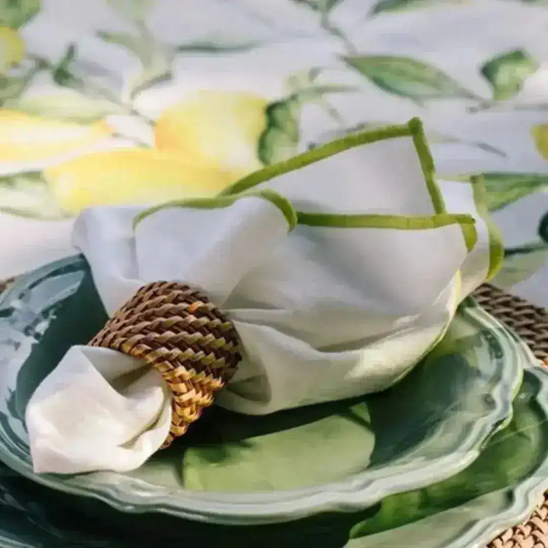 lemonade love placemat rattan texture close-up green scalloped ceramic plate white napkin wicker ring lemon tablecloth detail
