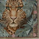 Luxurious Leopard Legacy Wool Hand Knotted Area Rug featuring a stunning leopard face design surrounded by lush foliage on a square area rug. Perfect for adding a touch of exotic elegance to your bedroom or living room. This wool rug is an ideal choice for those seeking unique rugs for bedroom or living room decor.