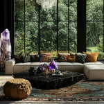 Luxurious living room featuring a Leopard Legacy wool hand-knotted square area rug. The rug adds elegance to the space, perfectly complementing the plush sofa and decorative pillows. Ideal for both bedroom and living room settings, this wool rug enhances the cozy ambiance with its intricate design.