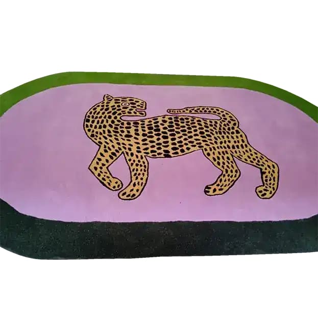 Discover the elegance of this hand-tufted wool area rug featuring a striking leopard design on a pink oval background. Perfect for large living rooms or bedrooms, this wool rug adds a touch of wildlife charm to your decor, making it an ideal choice for area rugs in the living room.