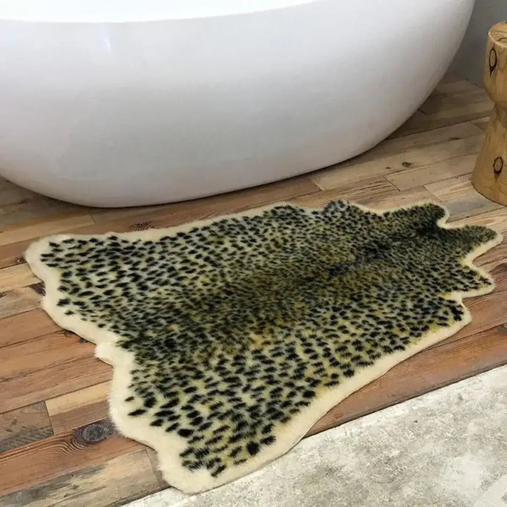 This image showcases a stylish Area Rug with a leopard print faux cowhide design, adding a touch of luxury to any living space. Perfect for those seeking large living room rugs or living room rugs 8x10, this rug is displayed on a wooden floor next to a modern bathtub, highlighting its versatility and chic appearance.