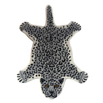 Leopard shaped wool accent rug in grey and white with black rosette spots, splayed legs and an embroidered snow leopard face