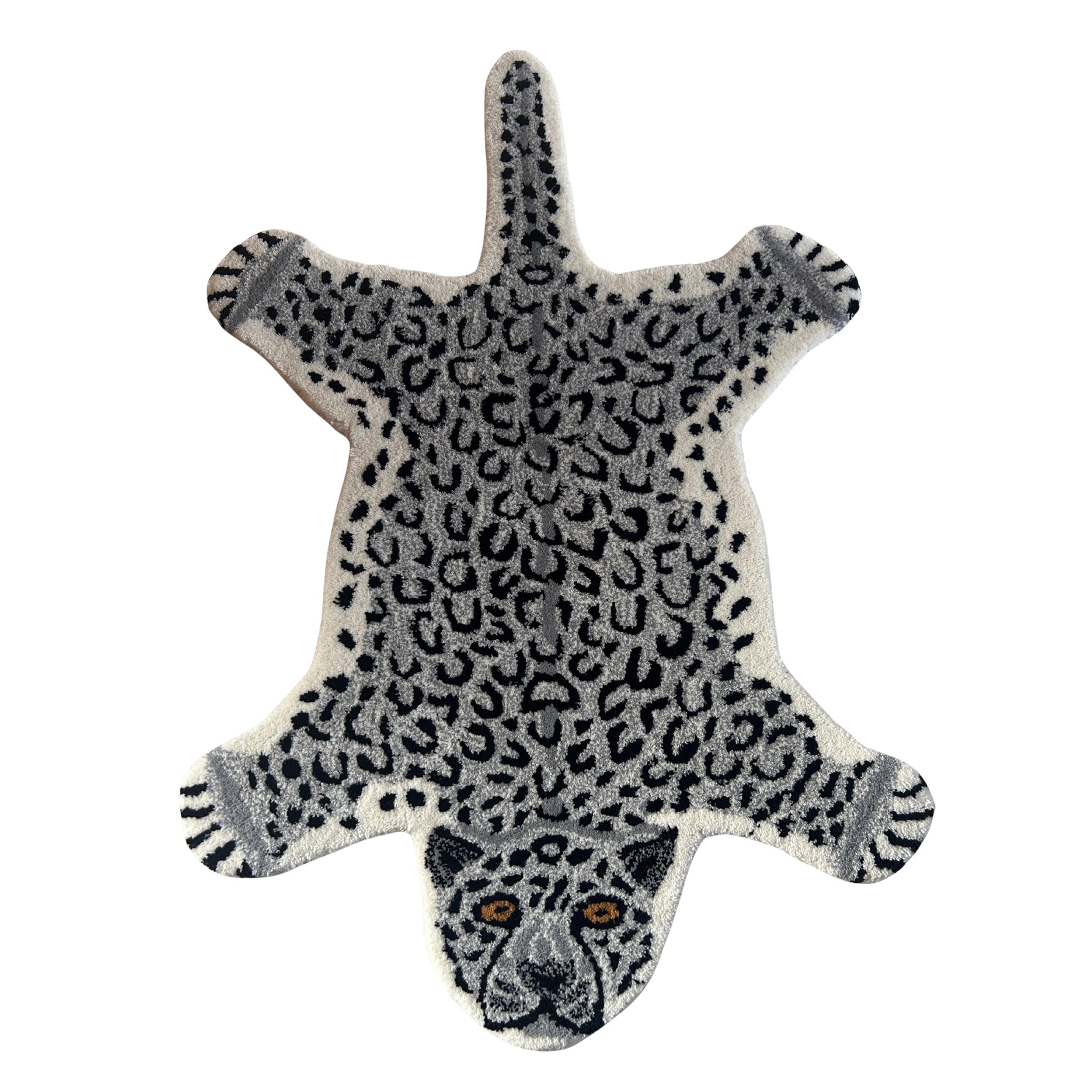 Leopard shaped wool accent rug in grey and white with black rosette spots, splayed legs and an embroidered snow leopard face