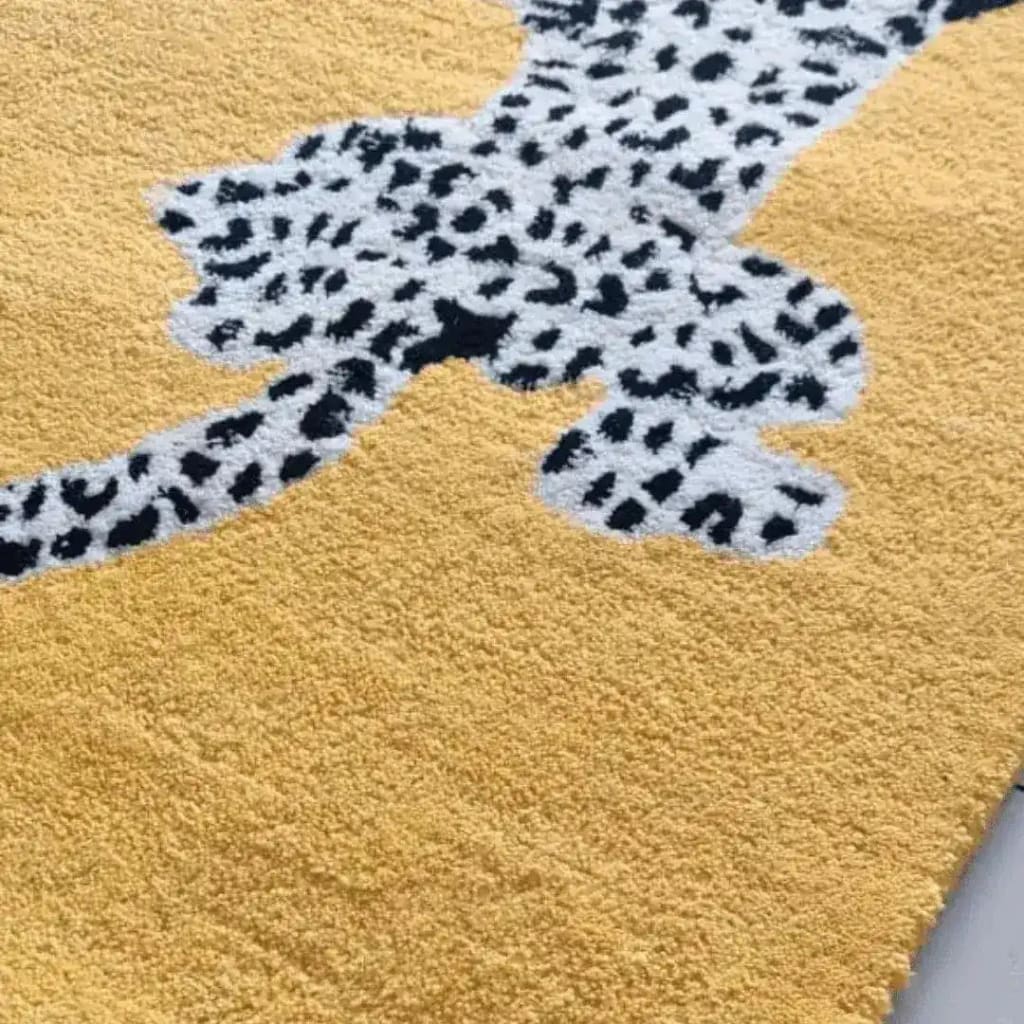 Close-up view of the Leopards on Silk Road Tufted Wool Rug Runner, showcasing a vibrant yellow background with detailed leopard pattern. Perfect for adding a touch of elegance to any area rug setting, be it as a hallway runner rug, in the dining room, or as a luxurious wool rug in the living room and dining room.