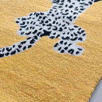 Close-up view of the Leopards on Silk Road Tufted Wool Rug Runner, showcasing a vibrant yellow background with detailed leopard pattern. Perfect for adding a touch of elegance to any area rug setting, be it as a hallway runner rug, in the dining room, or as a luxurious wool rug in the living room and dining room.