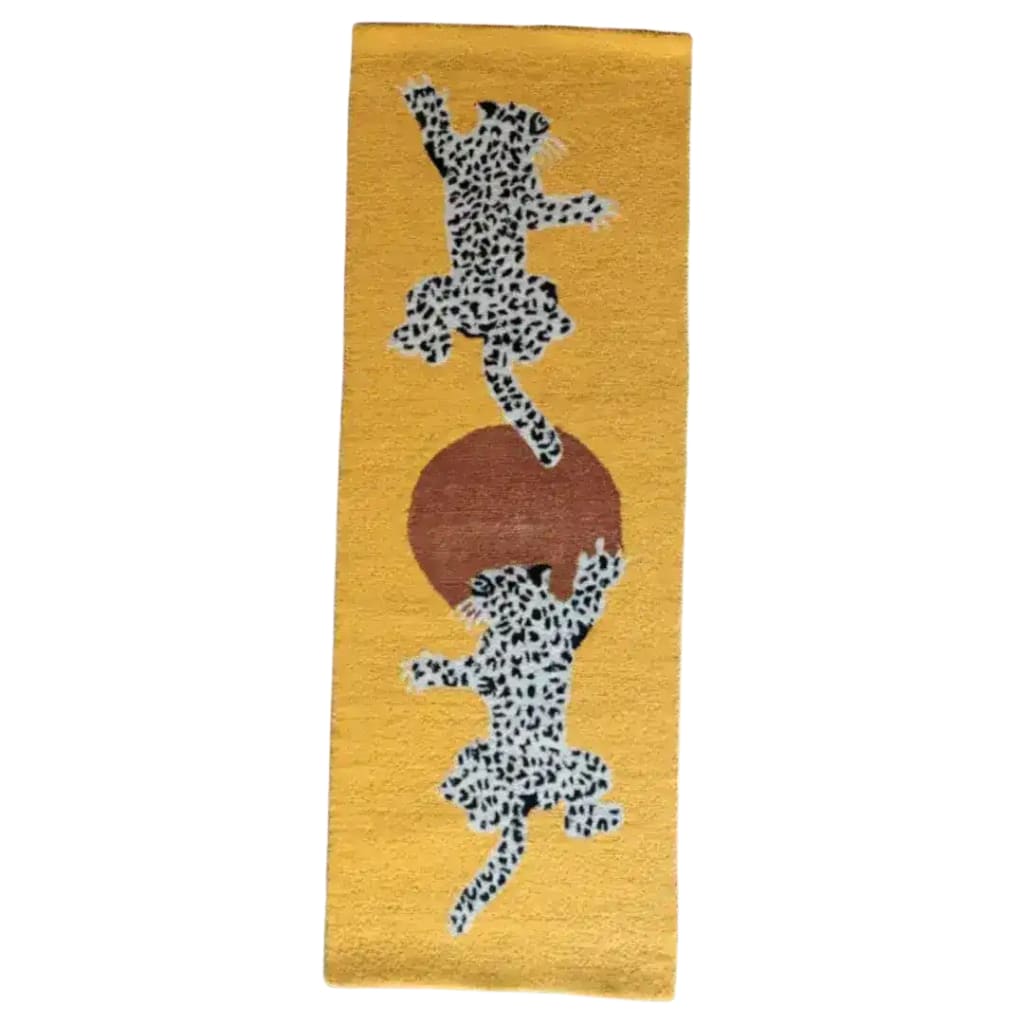 Leopards on Silk Road Tufted Wool Rug Runner featuring two leopards playfully positioned over a sun motif on a vibrant mustard background. Perfect as an area rug for the kitchen, hallway runner rug, dining room area rugs, or as a stylish wool rug for living room and dining room decor. Ideal for adding a touch of exotic elegance to any space, including as kitchen runner rugs or bathroom runner rug.