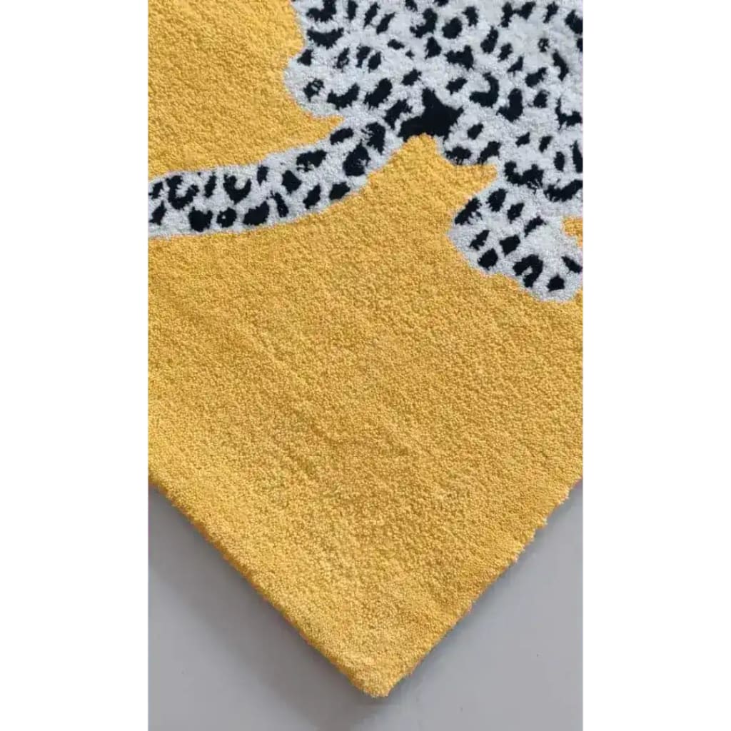 Close-up of the Leopards on Silk Road Tufted Wool Rug Runner, highlighting its vibrant yellow base with a detailed leopard pattern. Perfect as a luxurious area rug for kitchens, hallways, or dining rooms, this wool rug adds a touch of elegance to any living space.