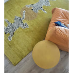 Top view of a unique wool area rug featuring playful leopards on a vibrant green background, perfect for adding a touch of the wild to your living room, hallway, or kitchen. This hand tufted wool rug runner is ideal for those seeking stylish kitchen rugs, a hallway runner rug, or large area rugs for the living room.