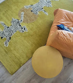 Top view of a unique wool area rug featuring playful leopards on a vibrant green background, perfect for adding a touch of the wild to your living room, hallway, or kitchen. This hand tufted wool rug runner is ideal for those seeking stylish kitchen rugs, a hallway runner rug, or large area rugs for the living room.