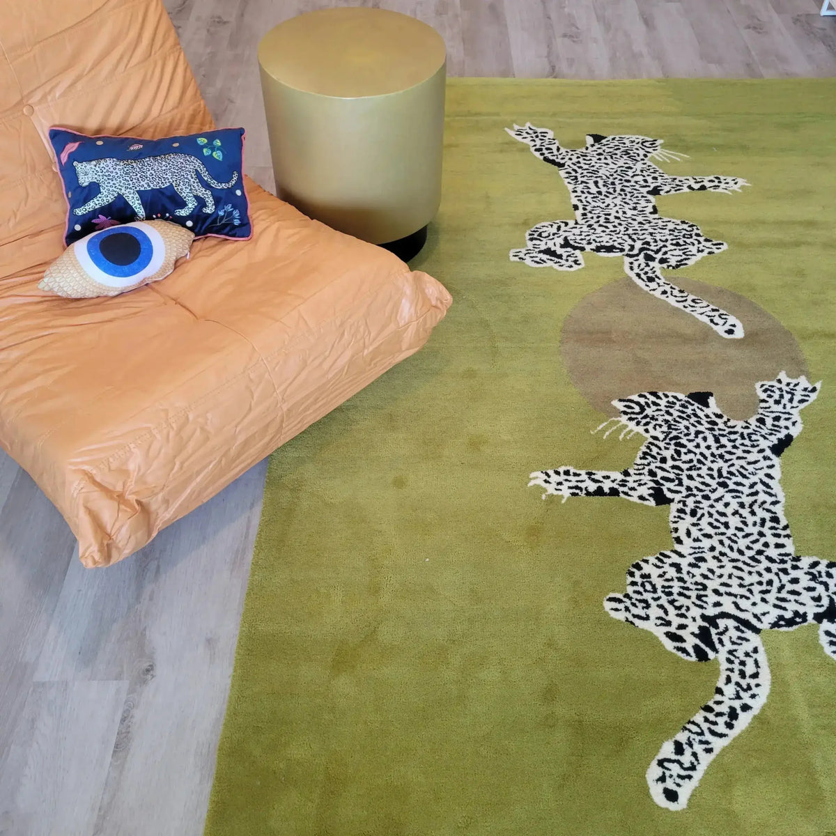 Stylish area rug featuring leopards on a green background, ideal for use as a hallway runner rug or in living rooms. This hand-tufted wool rug adds a touch of exotic elegance, perfectly complementing spaces like the kitchen or bathroom as a runner or in large living areas, bringing warmth and character to any room.