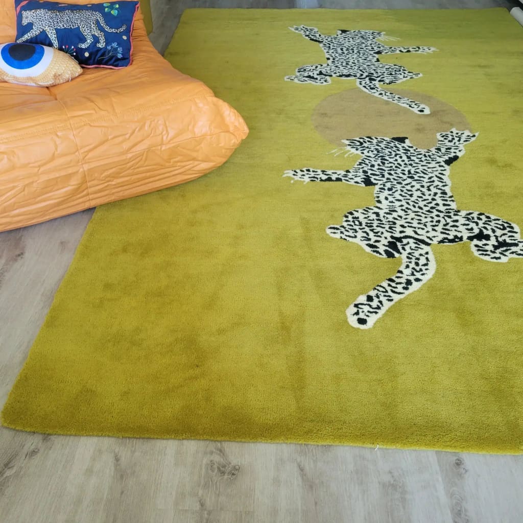 Stylish hand tufted wool area rug in a vibrant yellow-green shade, featuring striking leopard designs, perfect for adding a splash of creativity to your living room or as a unique hallway runner rug. Ideal for those seeking large area rugs for their home decor.