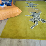 Stylish hand tufted wool area rug in a vibrant yellow-green shade, featuring striking leopard designs, perfect for adding a splash of creativity to your living room or as a unique hallway runner rug. Ideal for those seeking large area rugs for their home decor.