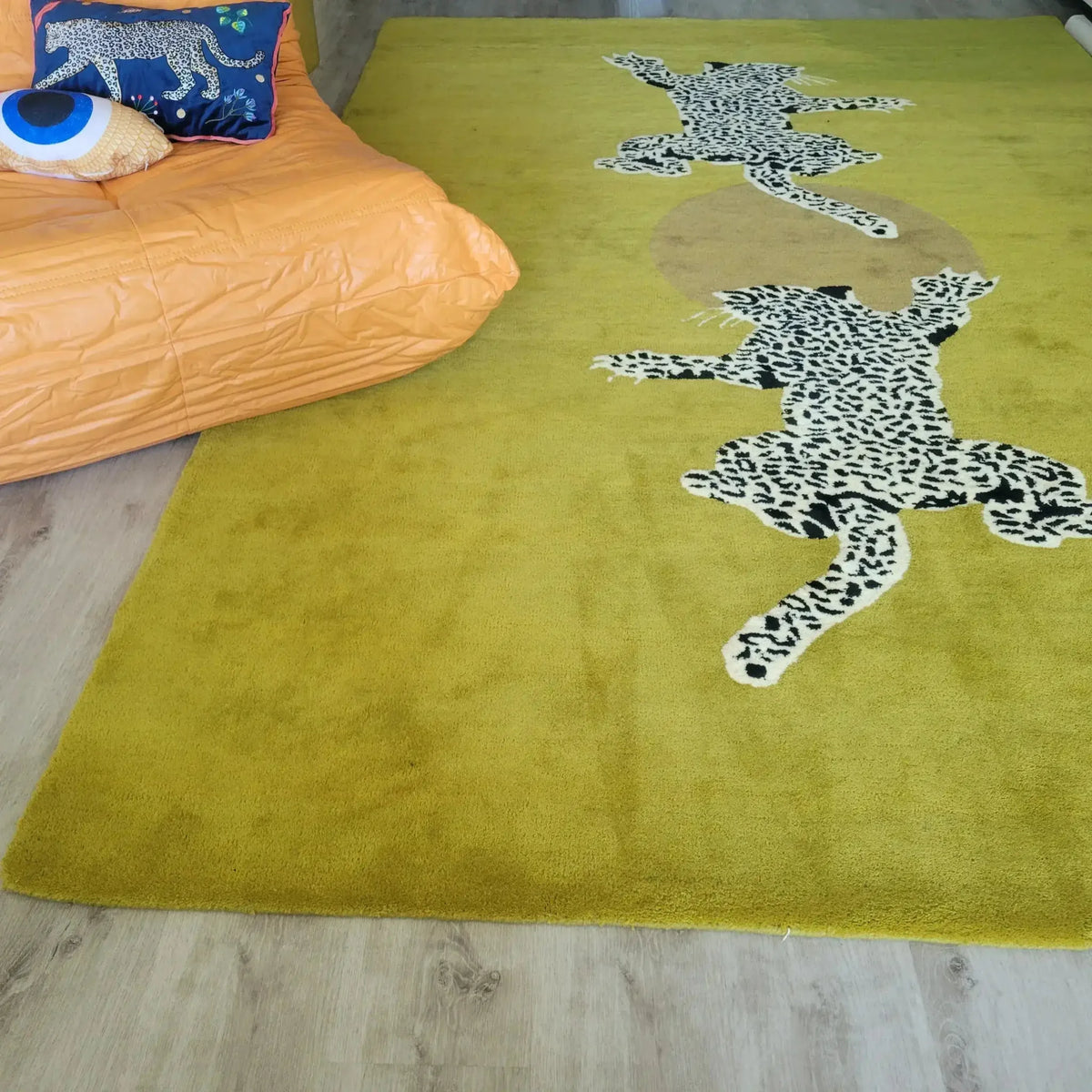 Stylish hand tufted wool area rug in a vibrant yellow-green shade, featuring striking leopard designs, perfect for adding a splash of creativity to your living room or as a unique hallway runner rug. Ideal for those seeking large area rugs for their home decor.