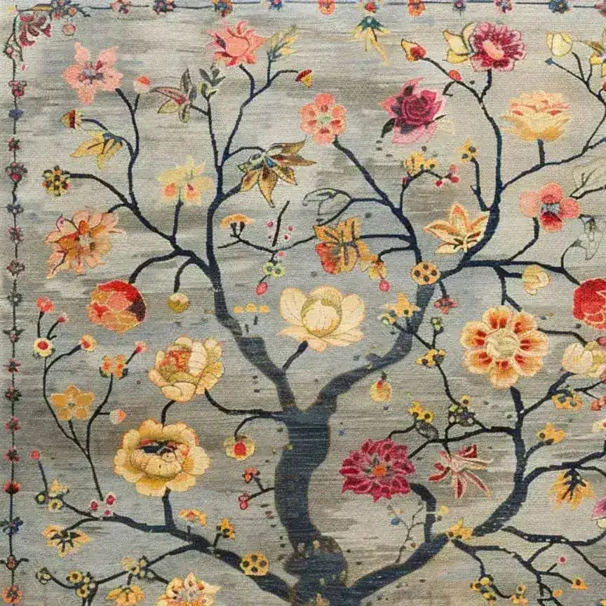 A beautifully detailed hand-knotted area rug featuring a vintage floral design. The rug displays an intricate pattern of colorful flowers and branches against a muted background, making it an ideal Persian-style rug for living rooms. This floral rug combines elegance and timeless charm, perfect for enhancing any interior space with its vibrant and classic aesthetic.