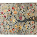 Stunning Life’s Embrace Tapestry Hand Knotted Area Rug featuring a beautiful floral design with vibrant flowers and intricate branches against a vintage-style background. Perfect for adding elegance to any living room space, this Persian-inspired rug is an ideal choice for those seeking exquisite area rugs for living room decor.