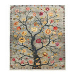 The Life’s Embrace Tapestry Hand Knotted Area Rug showcases an intricate floral design with vibrant blooms on a vintage-inspired background. Perfect for adding a touch of elegance to any living room, this Persian-style rug combines artistry with functionality, making it a standout piece among area rugs for living rooms.