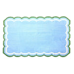 A light blue handmade reversible cotton area rug, measuring 3' x 5', featuring a charming scalloped edge. Perfect for adding a boho touch to your living room, this rug showcases a soothing blue hue with green and white accents, making it an ideal choice for living room area rugs or as a centerpiece in any space.