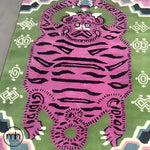 Top view of a light green oriental tiger hand-tufted wool rug, featuring a bold abstract tiger design in purple and black. This vintage rug adds a unique touch to any bedroom or office, offering a stylish and durable area rug option.