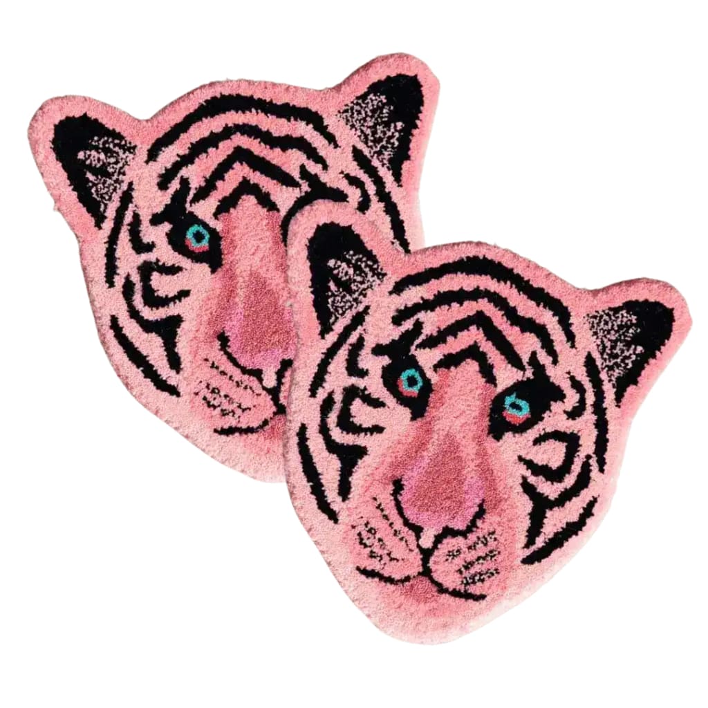 A vibrant light pink tiger face hand-tufted wool area rug, perfect for adding a playful touch to a dining room or living room. This unique wool rug showcases intricate black stripe details and vivid blue eyes, making it an ideal choice for formal dining room rugs and living room and dining room rugs.