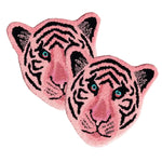 A vibrant light pink tiger face hand-tufted wool area rug, perfect for adding a playful touch to a dining room or living room. This unique wool rug showcases intricate black stripe details and vivid blue eyes, making it an ideal choice for formal dining room rugs and living room and dining room rugs.