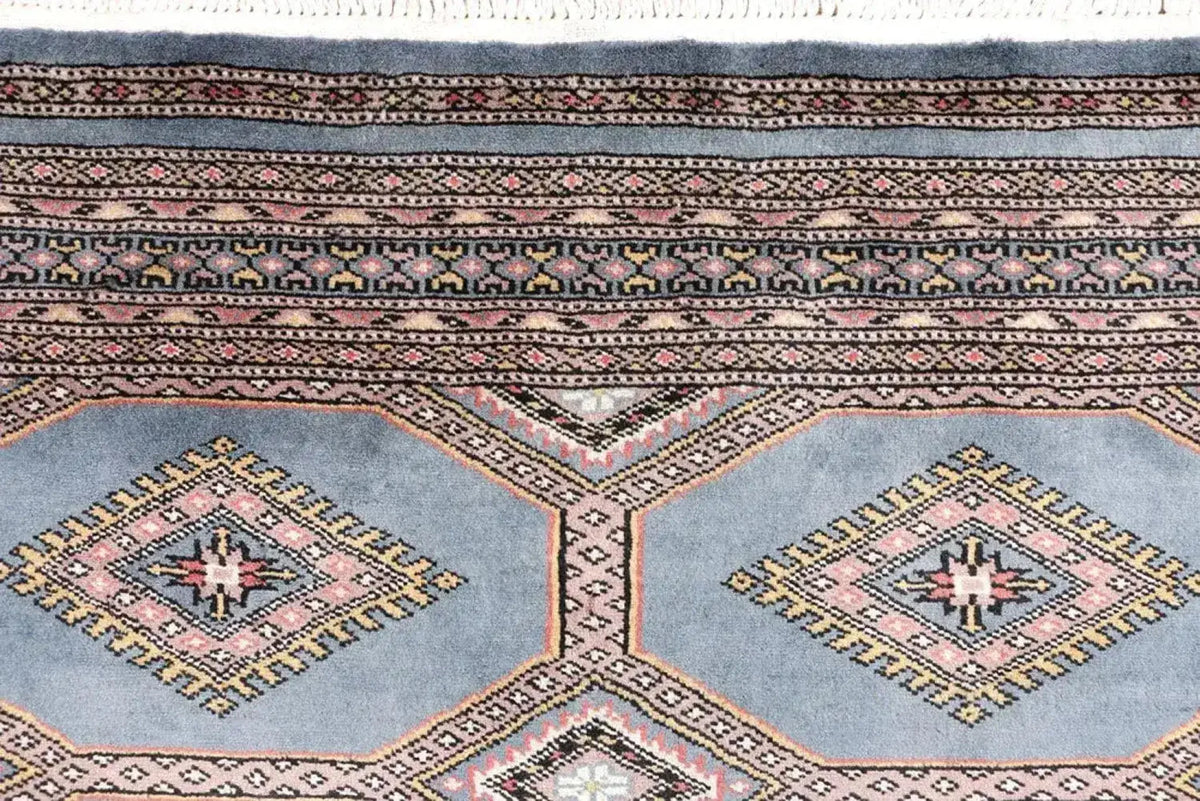 Close-up view of a Light Slate Grey Rajasthani Hand Knotted Area Rug, showcasing intricate patterns and textures. Ideal for adding warmth and style to area rugs for living room, especially in an 8x10 size.