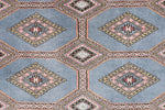 This Light Slate Grey Rajastani Hand Knotted Area Rug showcases a beautiful geometric pattern with intricate designs in soft pastel colors. Perfect for adding elegance to area rugs for living room, this 8x10 living room rug features a classic yet stylish look.