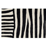 A modern Runner Rug featuring an abstract black and white striped pattern, ideal for contemporary spaces. This hand tufted wool rug is perfect for use as kitchen rugs, hallway runner rug, kitchen runner rugs, or even as a stylish bathroom runner rug.