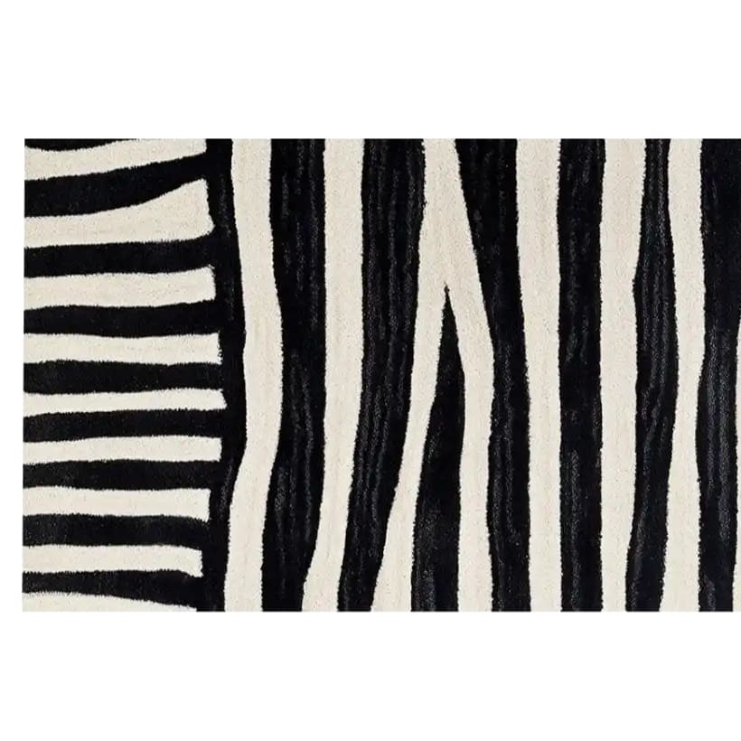 A modern Runner Rug featuring an abstract black and white striped pattern, ideal for contemporary spaces. This hand tufted wool rug is perfect for use as kitchen rugs, hallway runner rug, kitchen runner rugs, or even as a stylish bathroom runner rug.