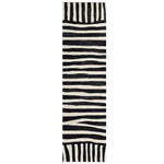 Top view of the Light Surge Hand Tufted Wool Runner Rug featuring a striking black and white abstract pattern. Perfect for adding a contemporary touch to kitchens, hallways, or bathrooms, this wool rug combines style and functionality.