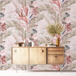 Light wood credenza with palm leaf against pink tropic breeze wallpaper of blush fronds