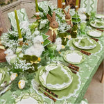 Lily of the Valley Elegance placemats in full spring table, green scalloped mats, lily-print china, Easter bunny centerpiece