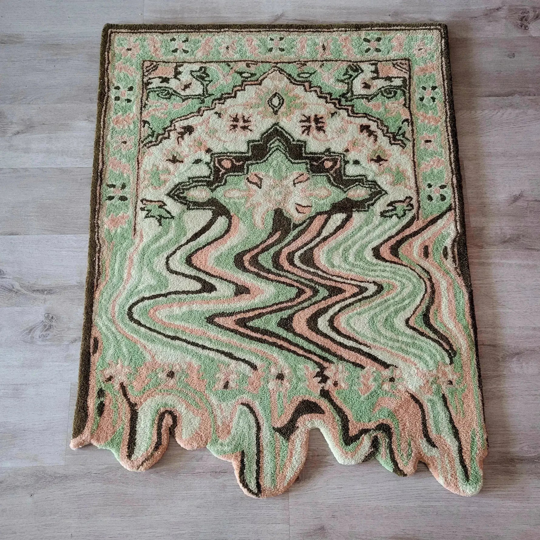 A vibrant Lime Green Melting Traditional Persian Hand Tufted Wool Rug displayed on a wooden floor. This abstract area rug features a blend of green, peach, and brown tones, ideal for enhancing dining rooms or living room spaces with its unique design.