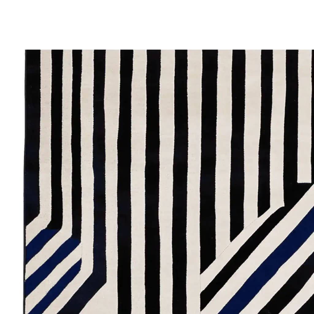A contemporary hand-tufted wool area rug with bold black and white stripes, perfect for enhancing large living rooms. This stylish area rug showcases a modern design, making it a great choice for anyone looking to add a touch of elegance to their living space.
