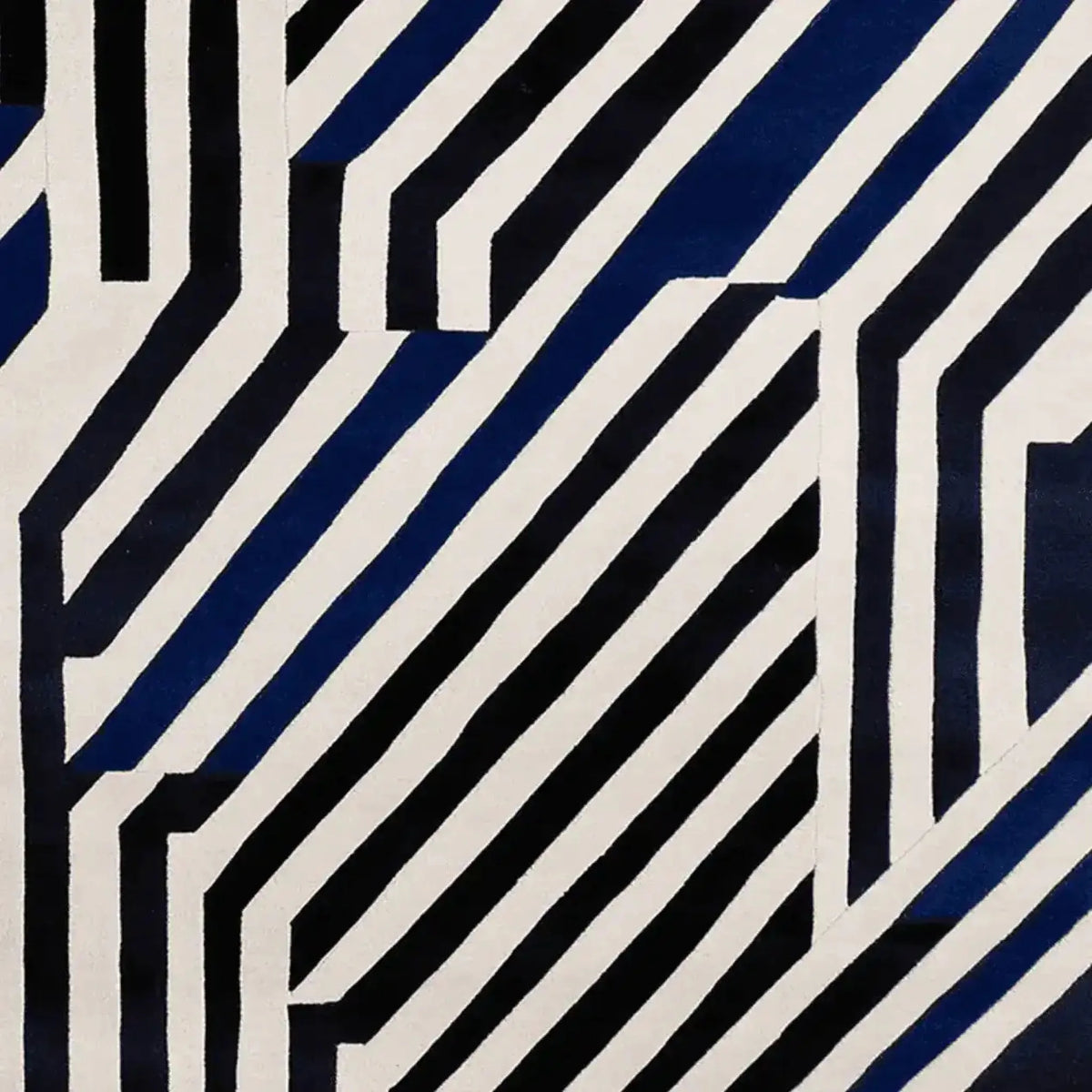 A stylish area rug featuring a bold, contemporary design with striking black and white geometric stripes. This wool rug is perfect for adding a modern touch to large living rooms, making it a standout area rug for any living room setting.