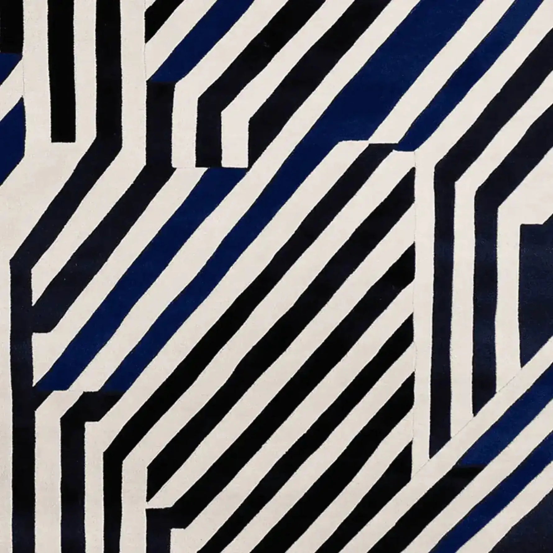 A stylish area rug featuring a bold, contemporary design with striking black and white geometric stripes. This wool rug is perfect for adding a modern touch to large living rooms, making it a standout area rug for any living room setting.