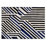 The Line Rhythm Hand Tufted Rug is a striking area rug featuring a bold geometric pattern in black, white, and blue. This contemporary wool rug is perfect for adding a modern touch to large living rooms, making it a standout piece among area rugs for living room settings.