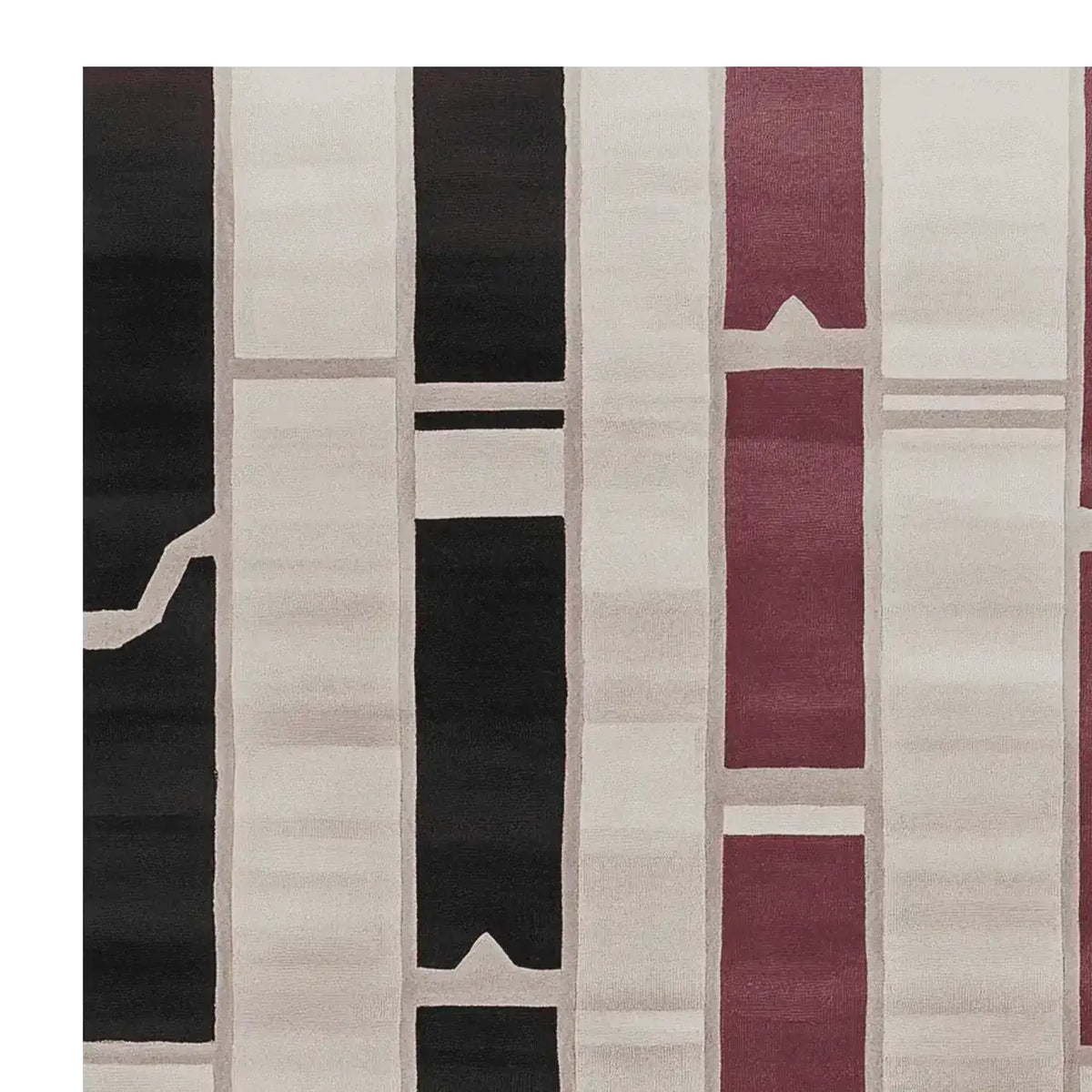 Close-up view of a contemporary wool area rug featuring bold geometric patterns in black, white, and burgundy, perfect for modern living room spaces. Ideal for living room area rugs, available in 8x10 size.