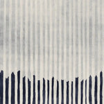 This contemporary rug features a dynamic pattern of vertical lines in shades of gray with bold navy accents at the bottom. Perfect for enhancing the style of any living room, this hand-tufted wool rug adds a touch of modern elegance, making it an ideal choice for those seeking unique area rugs for living room decor.