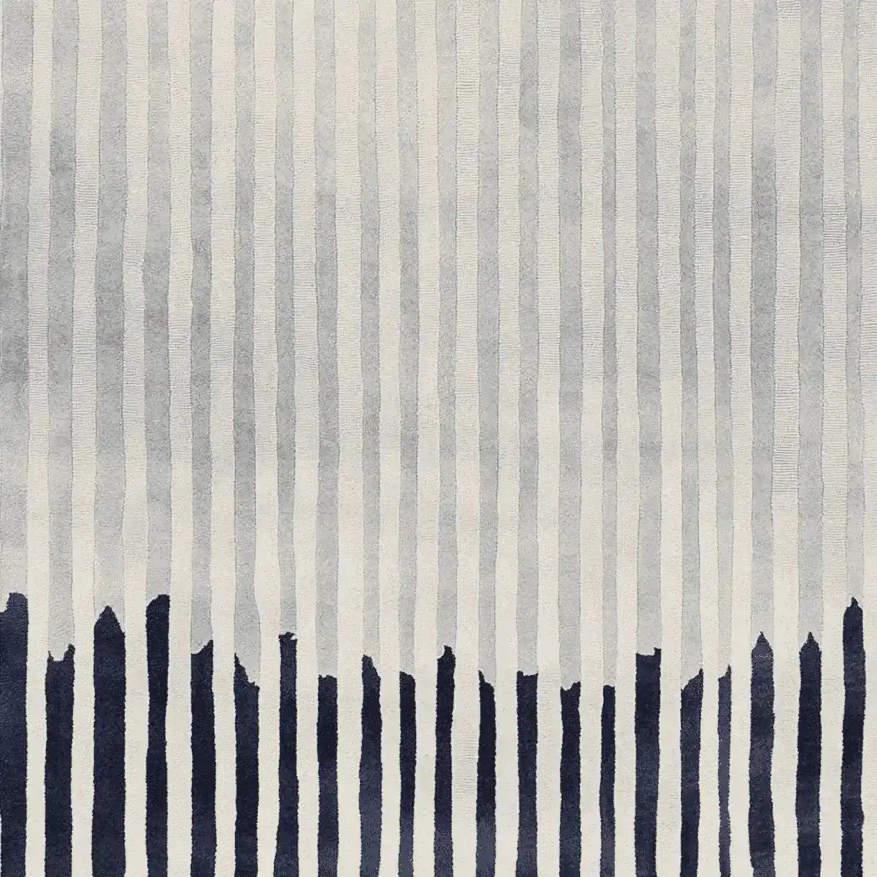 This contemporary rug features a dynamic pattern of vertical lines in shades of gray with bold navy accents at the bottom. Perfect for enhancing the style of any living room, this hand-tufted wool rug adds a touch of modern elegance, making it an ideal choice for those seeking unique area rugs for living room decor.